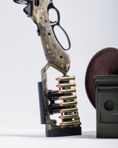 Modern lever action rifle with custom modifications and optics"