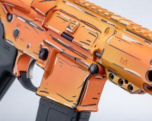 close up of Orange cartoon looking cel shaded cerakote on an AR15